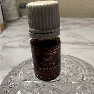 Young Living Sacred Frankincense Essential Oil - Brown and White